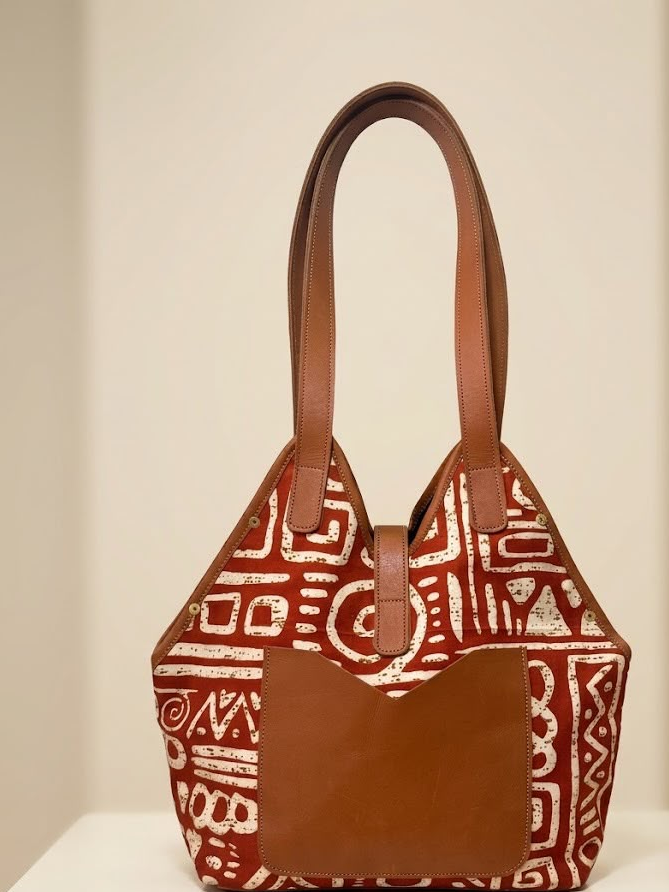 Two handcrafted Vessels tote bags arranged in a warm editorial setting
